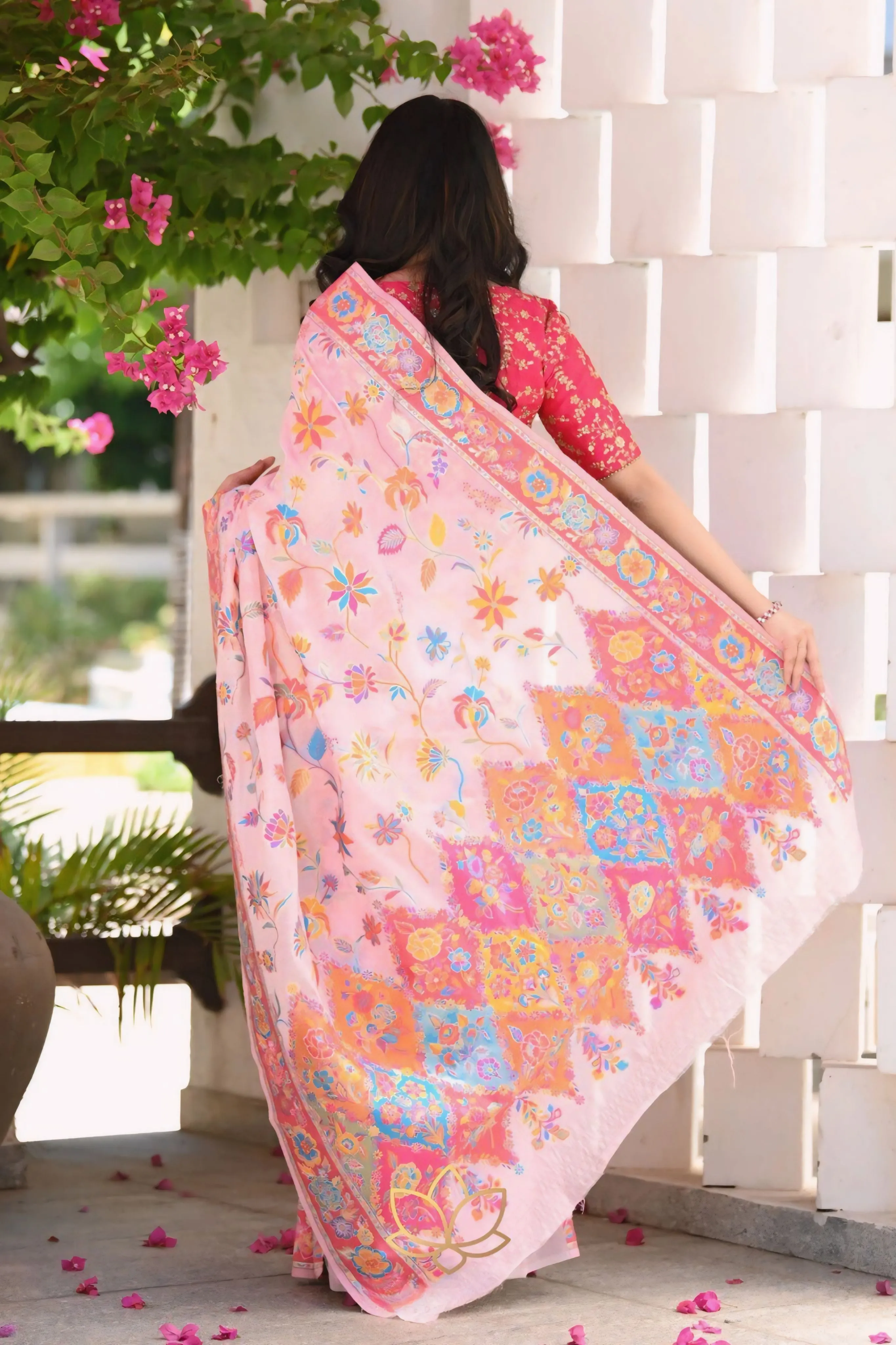 A SAREE ADORNED IN MULTICOLORE FLOWERS